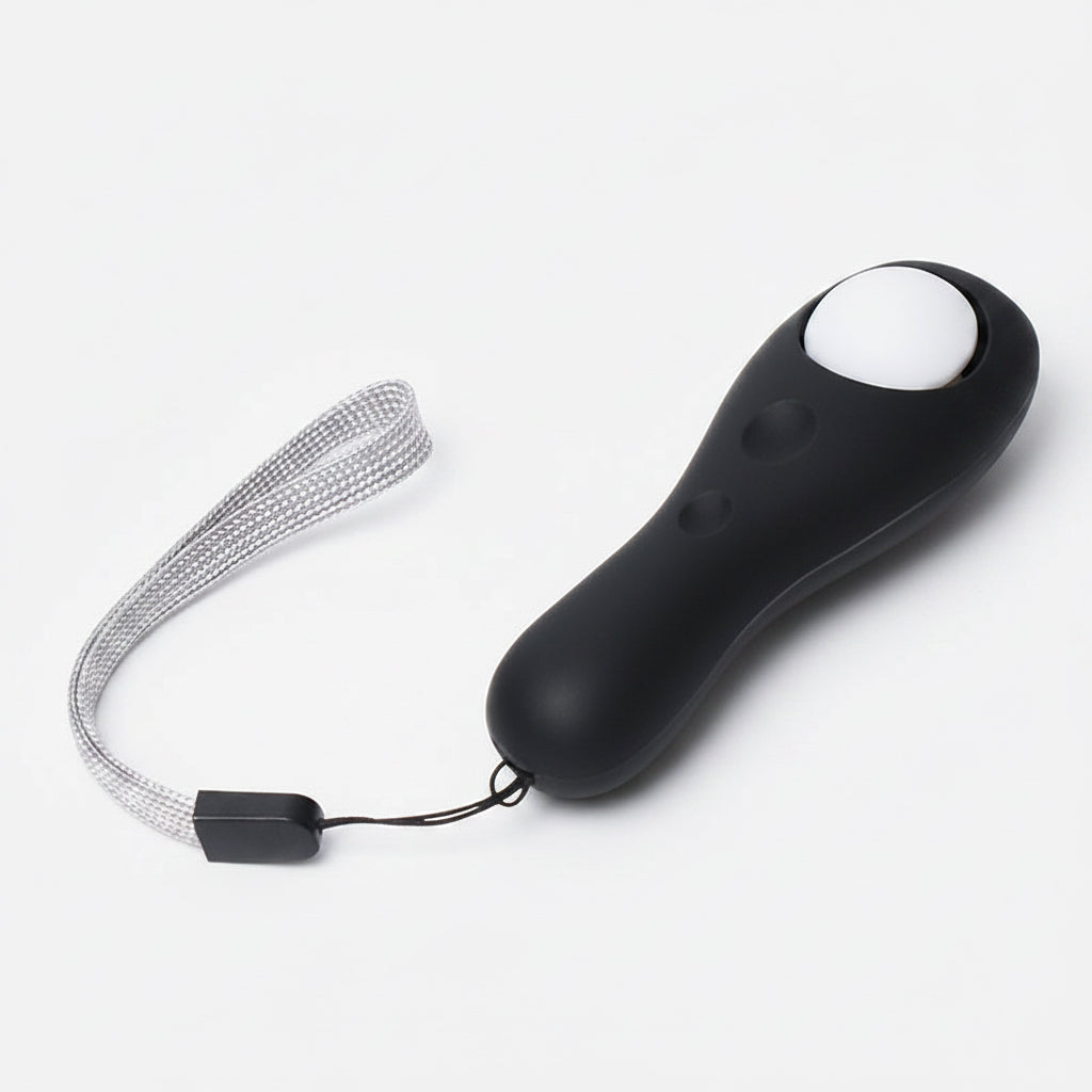 Black remote control with a white button on a white background
