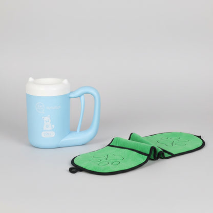 Blue mug on a wooden shelf with a green butterfly-shaped pot holder featuring paw prints.