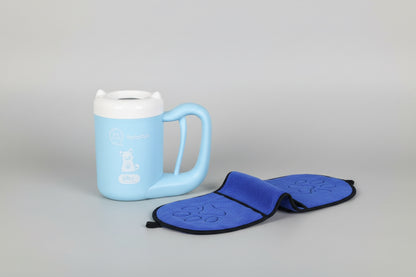 Blue mug on a wooden shelf with a blue featuring paw prints on a white background.