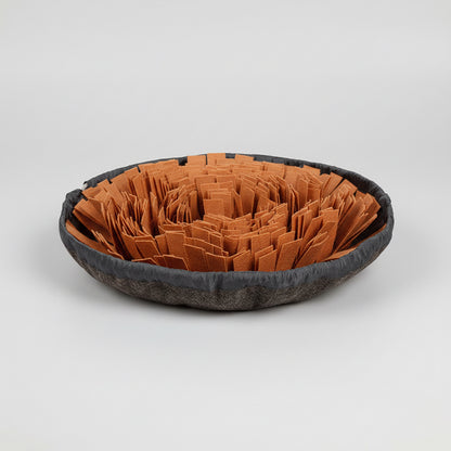 Pet bed with brown crumpled paper and gray border on a white background