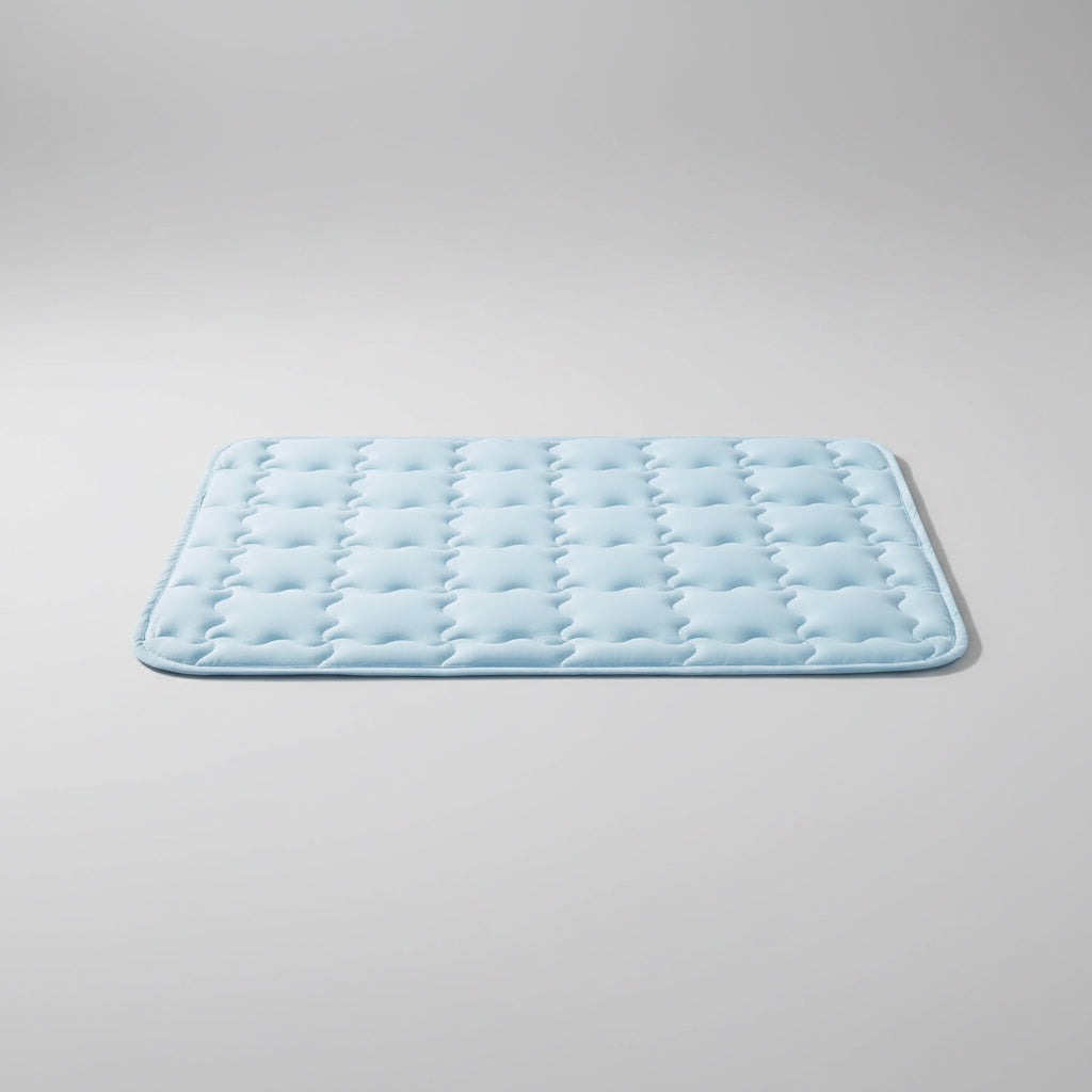 Dog lying on a cooling pad