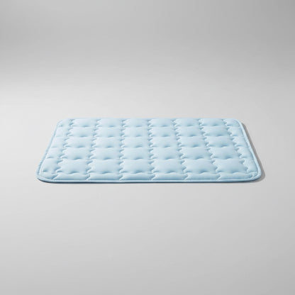Dog lying on a cooling pad
