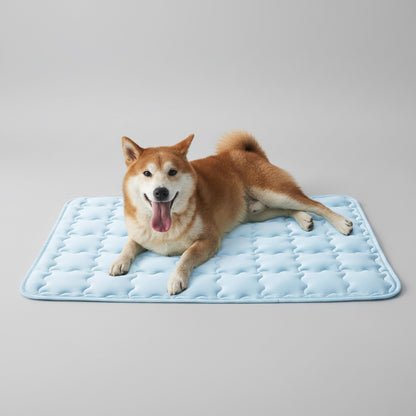 Dog lying on a cooling pad