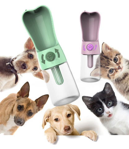 Dog drinking from built-in bowl of portable travel water bottle