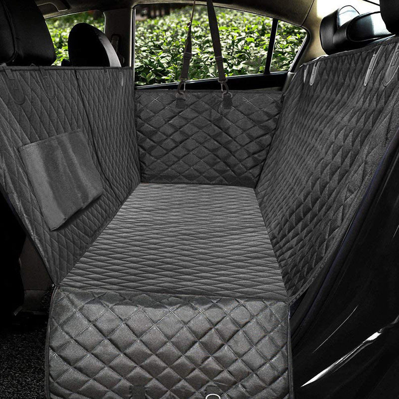 Gray car seat cover with diamond pattern in a vehicle