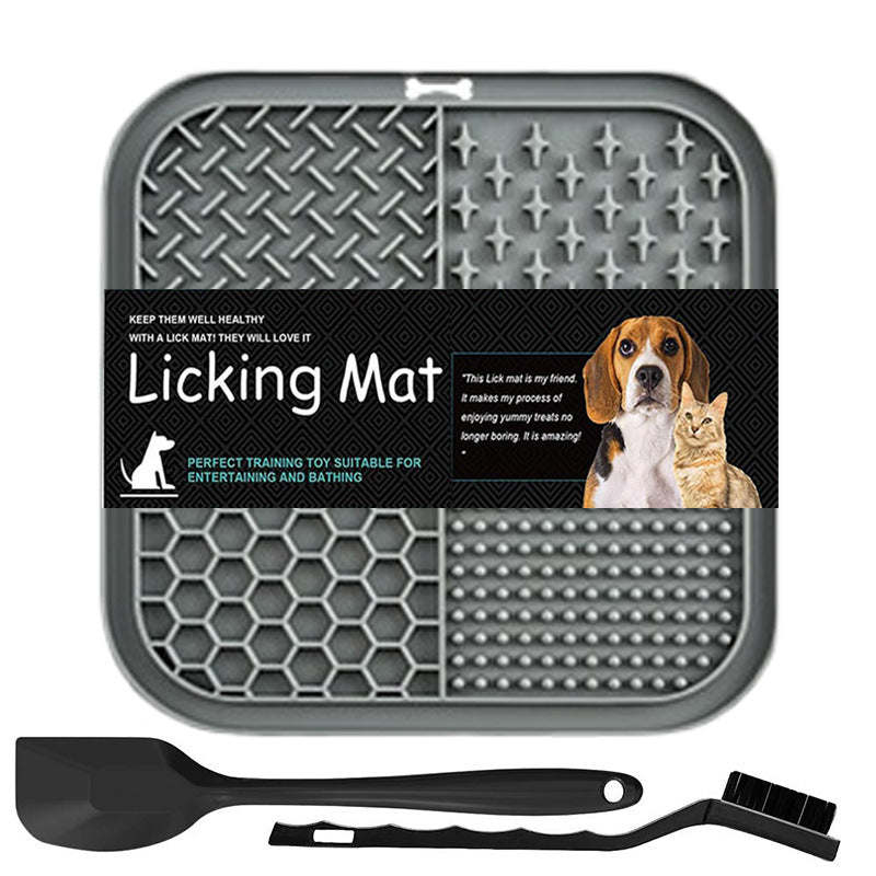 A gray silicone licking mat for dogs and cats 