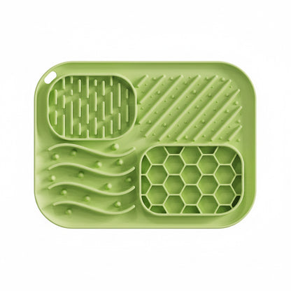Green silicone mat with textured design on a white background
