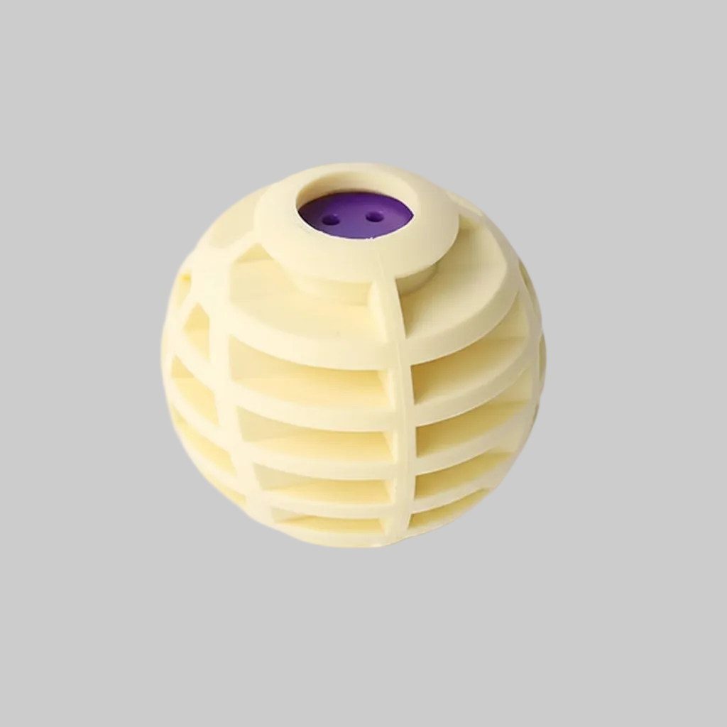 A spherical, cream-colored pet toy with a ribbed, honeycomb-like structure and a purple circular insert at the top, shown on a clean white background.