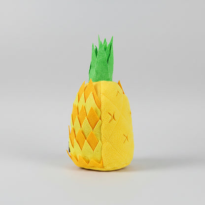 Plush pineapple toy with measurements on a white background