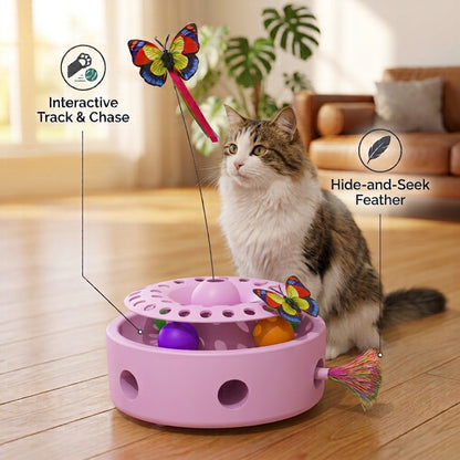 A calico and tabby cat watches a multi-functional interactive cat toy featuring a spinning ball track with purple and orange balls, a top-mounted butterfly wand, and a rainbow tassel feather. Callout icons label "Interactive Track & Chase" and "Hide-and-Seek Feather