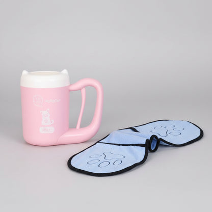 Pink mug on a wooden shelf with a blue paw print item next to it.