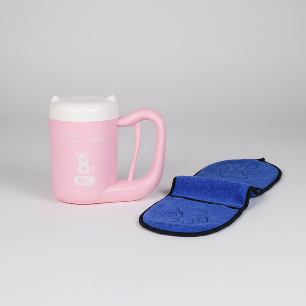Pink mug with a blue paw print oven mat next to it.