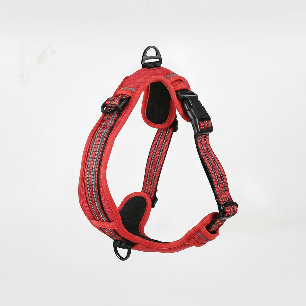Red dog harness with reflective stripes on a white background