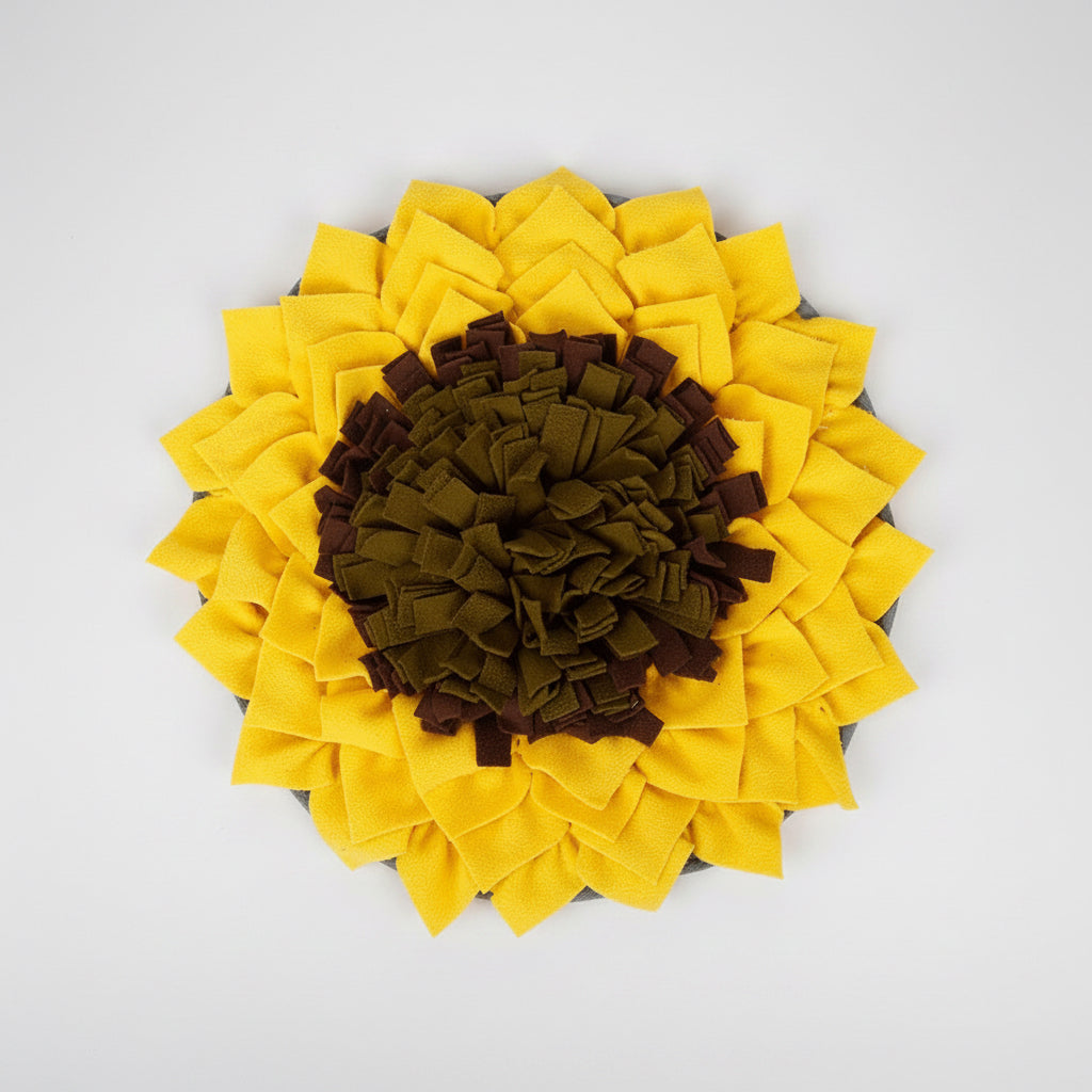 Sunflower-shaped pet mat with yellow petals and brown center on a white background