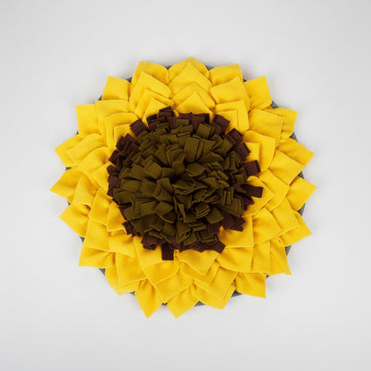 Sunflower-shaped pet mat with yellow petals and brown center on a white background