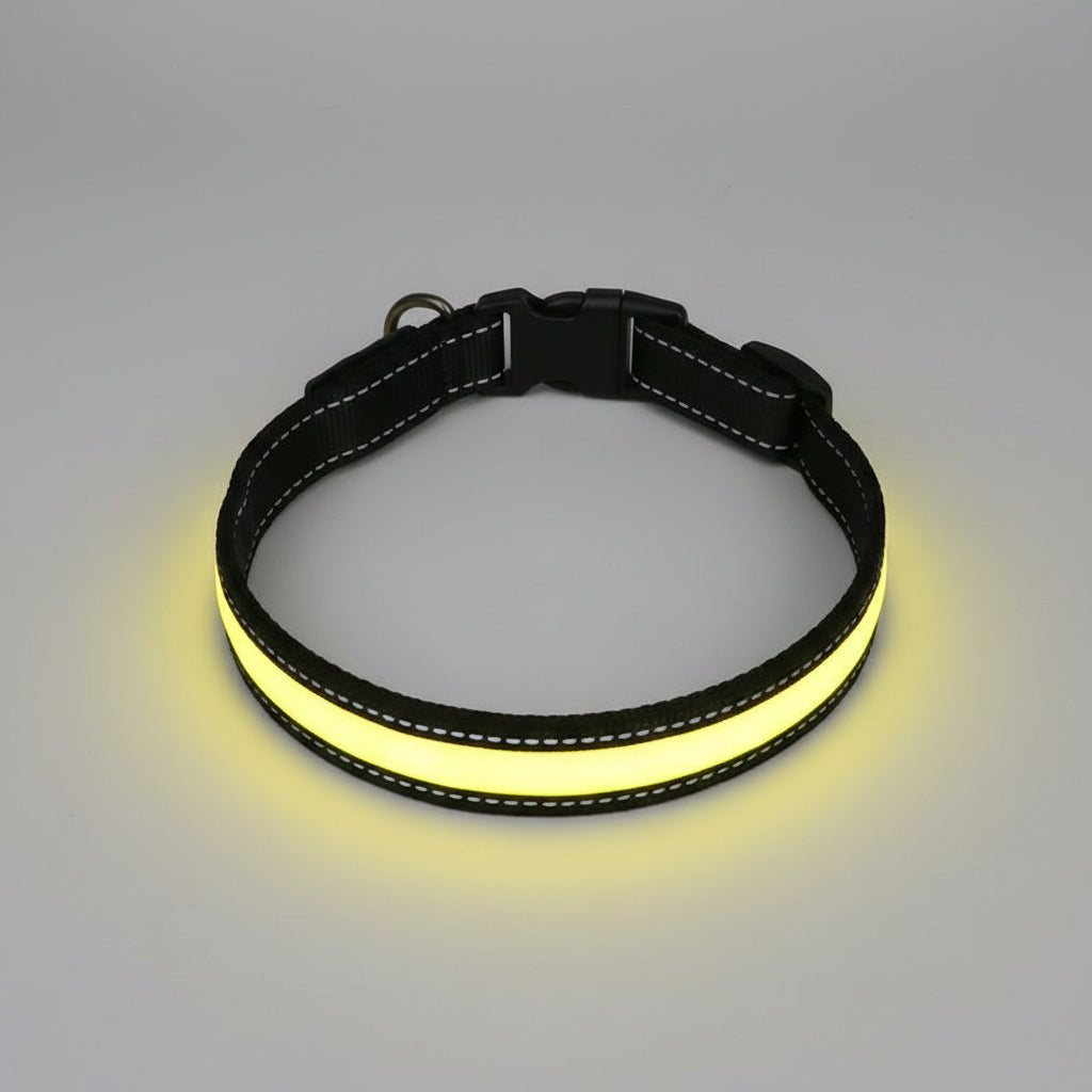 Black and yellow dog collar on a wooden surface