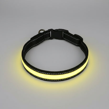 Black and yellow dog collar on a wooden surface