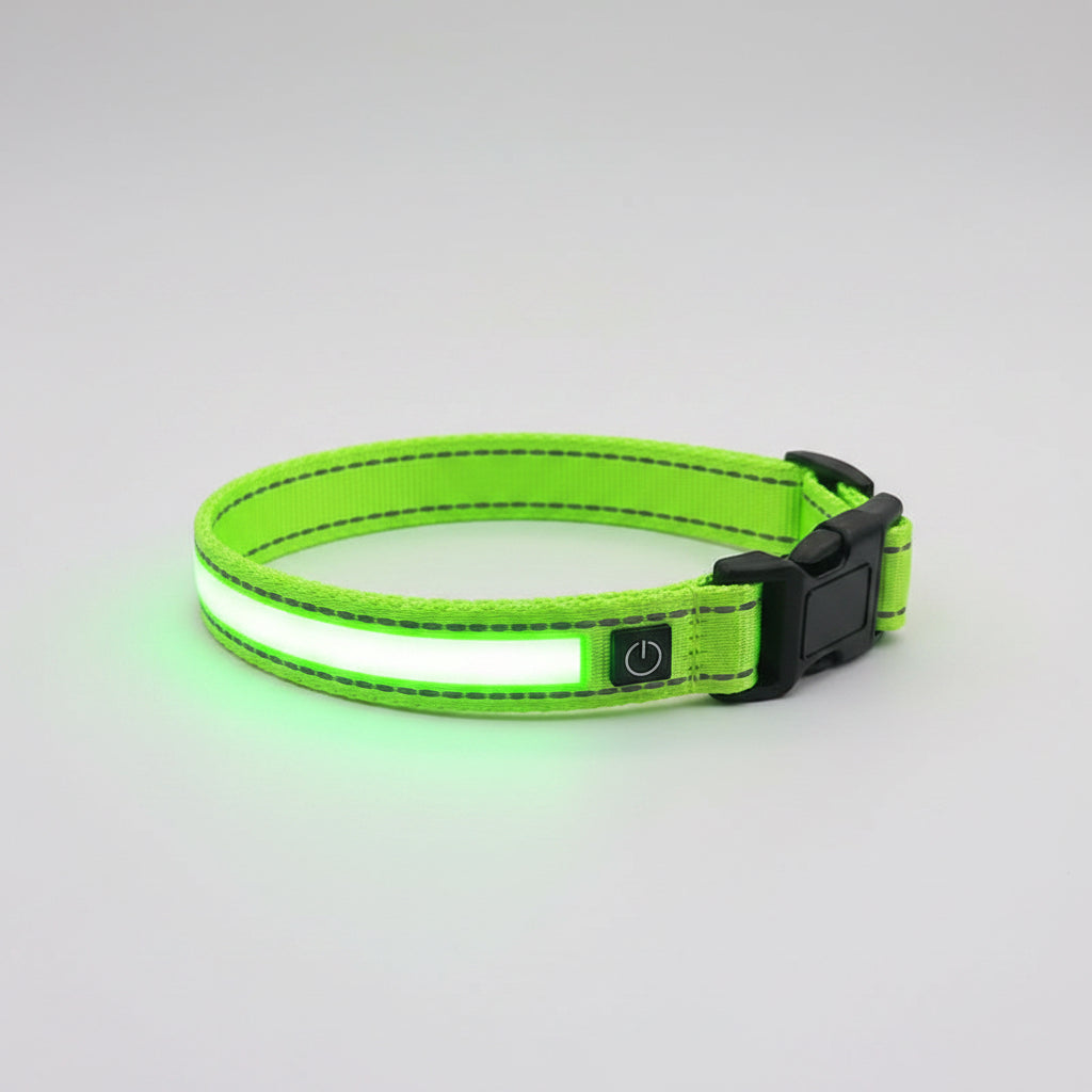 Green dog collar with a black label on a white background