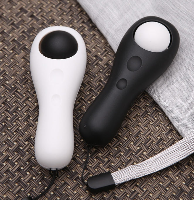 Two handheld Training Device.  one white and one black, on a textured surface.