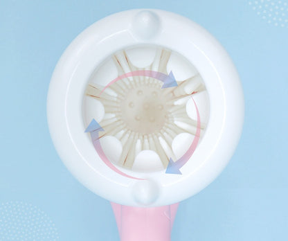 Close-up of a white and pink hairbrush on a light blue background